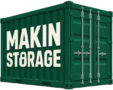 Green shipping container with large white text 'MAKIN STORAGE' on the side and metal doors at the rear, used for storage.